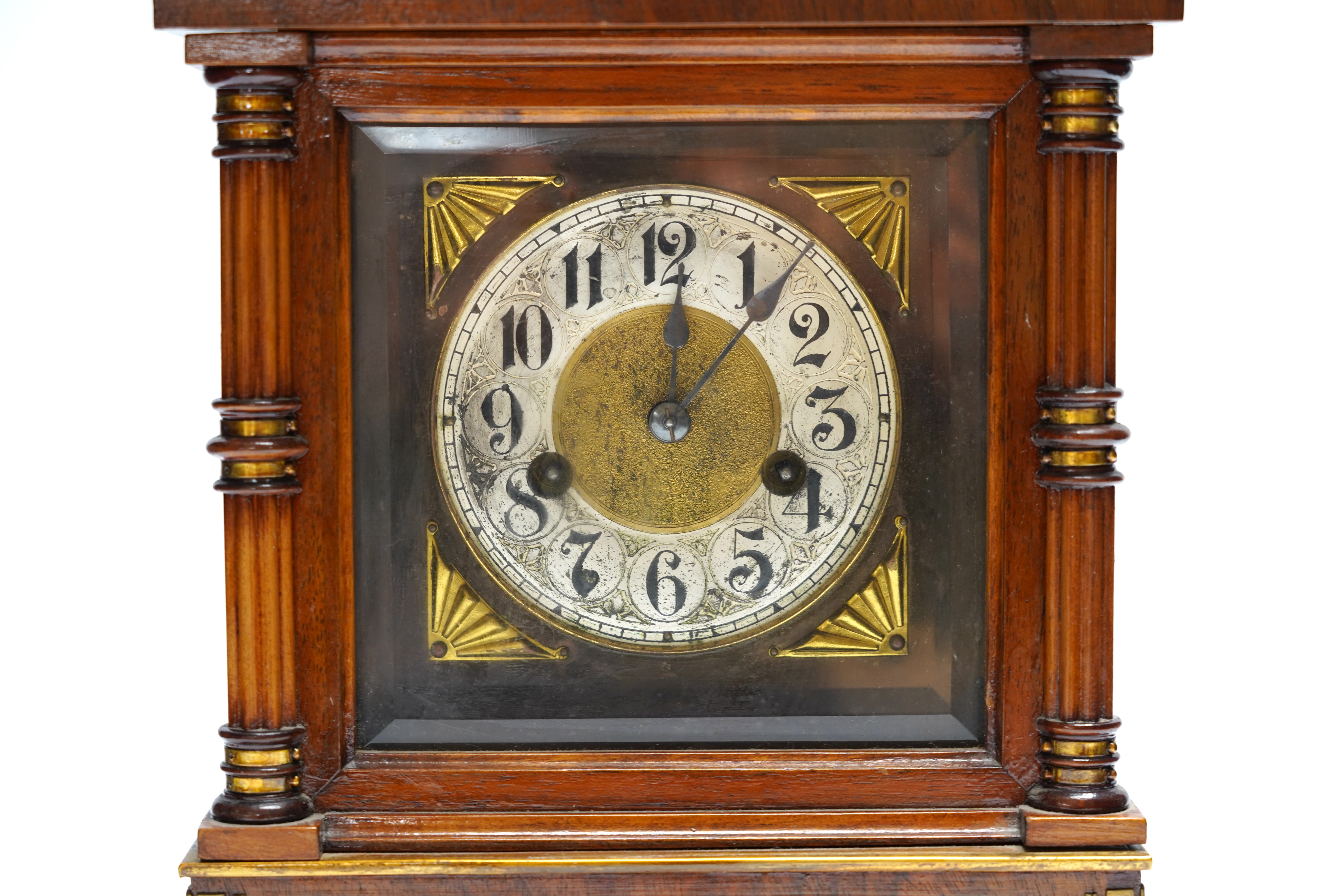 A Black Forest mantel clock with an HAC, Wurttemberg movement, striking on a coiled gong, 35cm high together with an early 20th century inlaid mahogany mantel clock